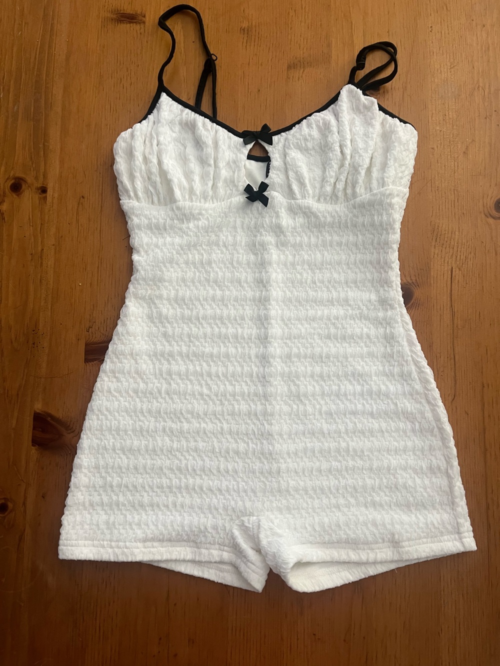 SHEIN White Textured Romper with Black Bow Trim